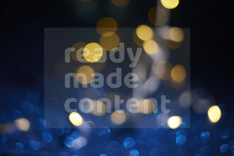 Bokeh light in yellow with blue background