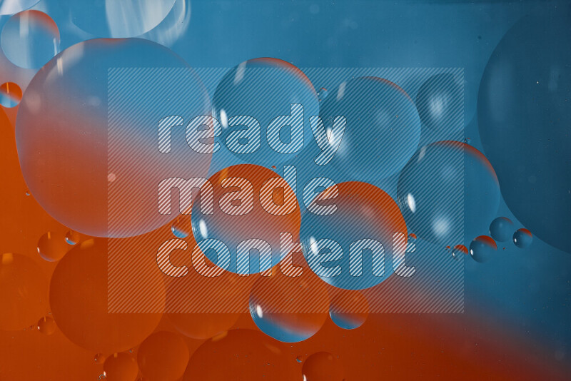 Close-ups of abstract oil bubbles on water surface in shades of blue and orange