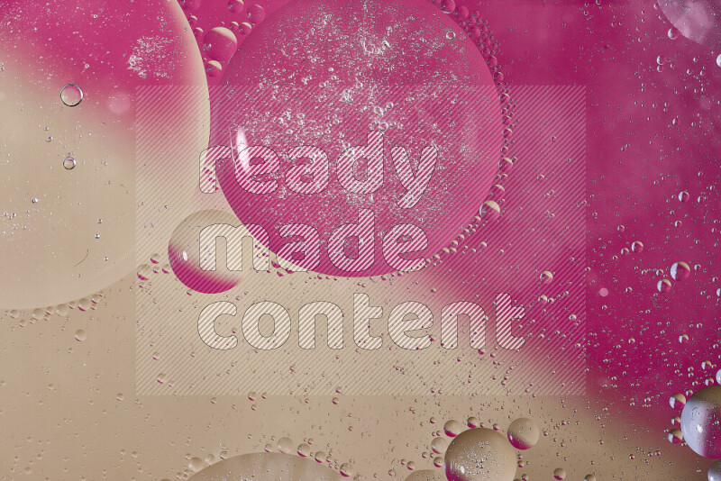 Close-ups of abstract oil bubbles on water surface in shades of pink and brown