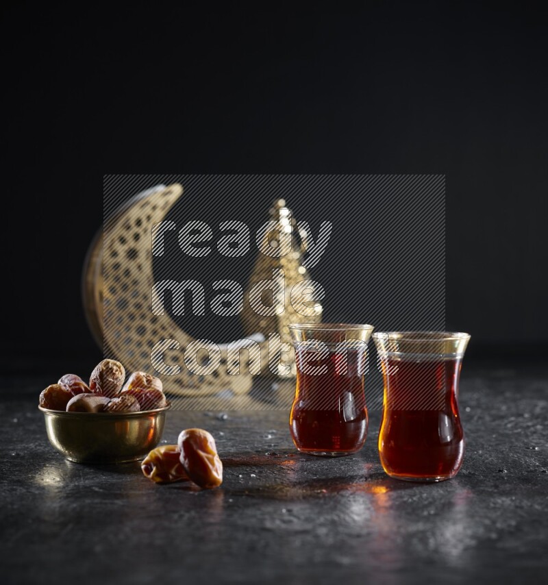 Dates with hot drinks and golden lanterns in a dark setup