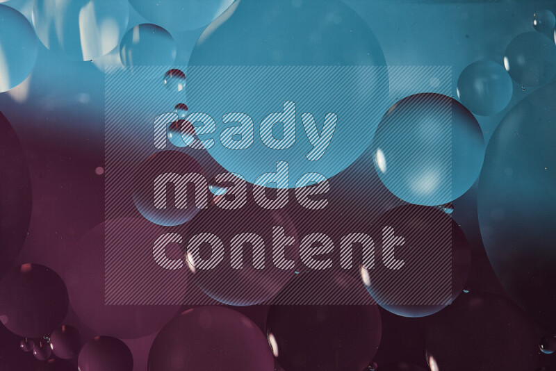 Close-ups of abstract oil bubbles on water surface in shades of blue and purple