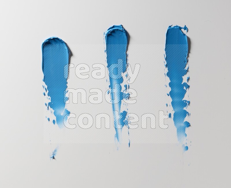 Blue painting knife strokes on white background