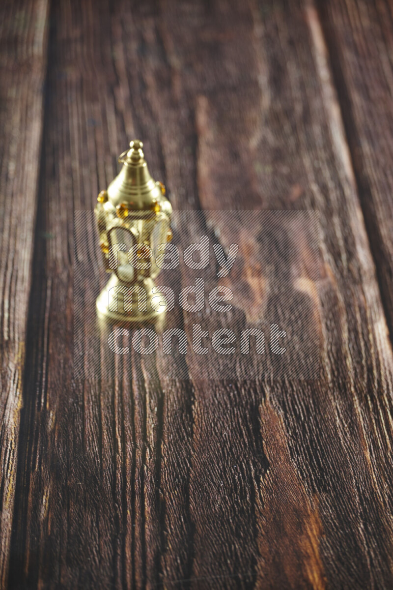 A lantern placed on a wooden background