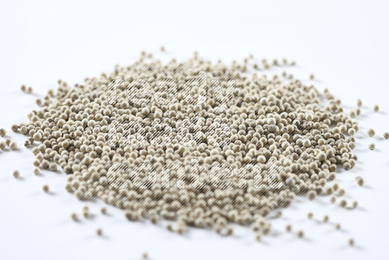 White pepper beads on white background