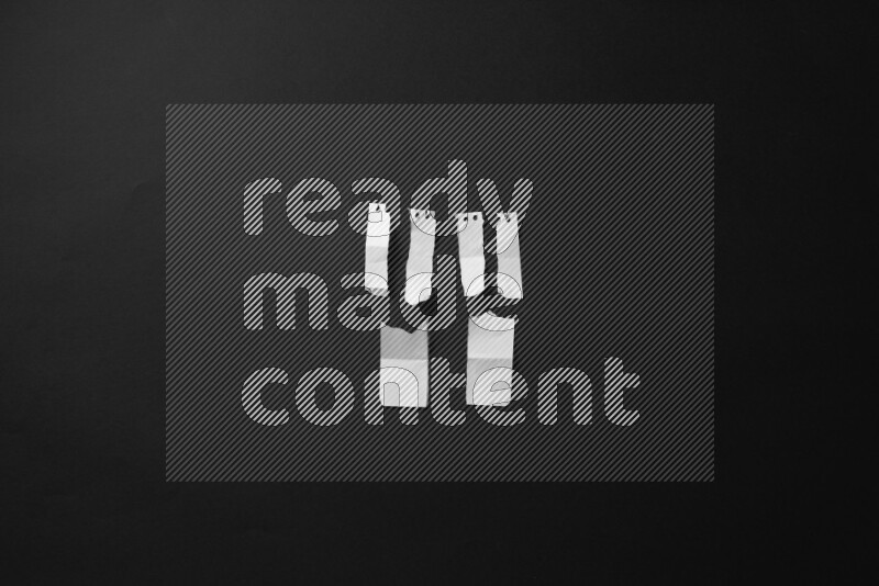 Ripped notebook sheet on black background