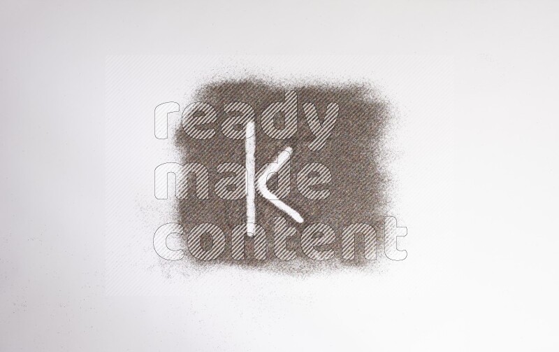 Alphabets written with glitter on white background