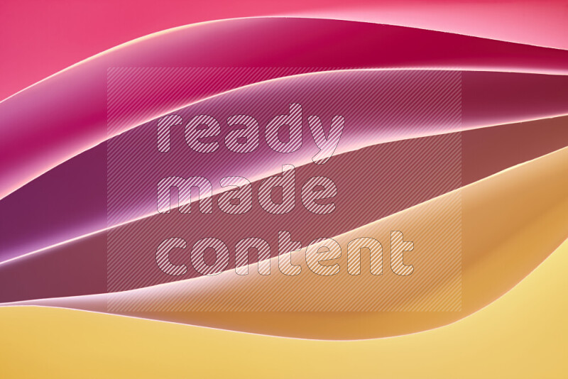 هذه الصورة تعرض تكوين فن الورق التجريدي مع منحنيات ورقية بتدرجات لونية دافئة مختلفة المكونه بواسطة الضوء الملون