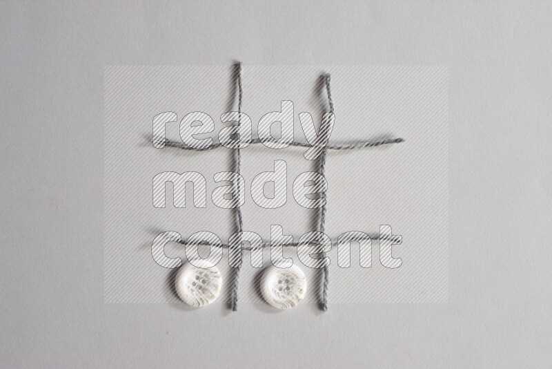 White buttons placed on grey background