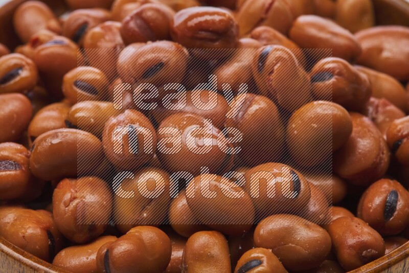 Close up shot of cooked fava beans (foul) on white background