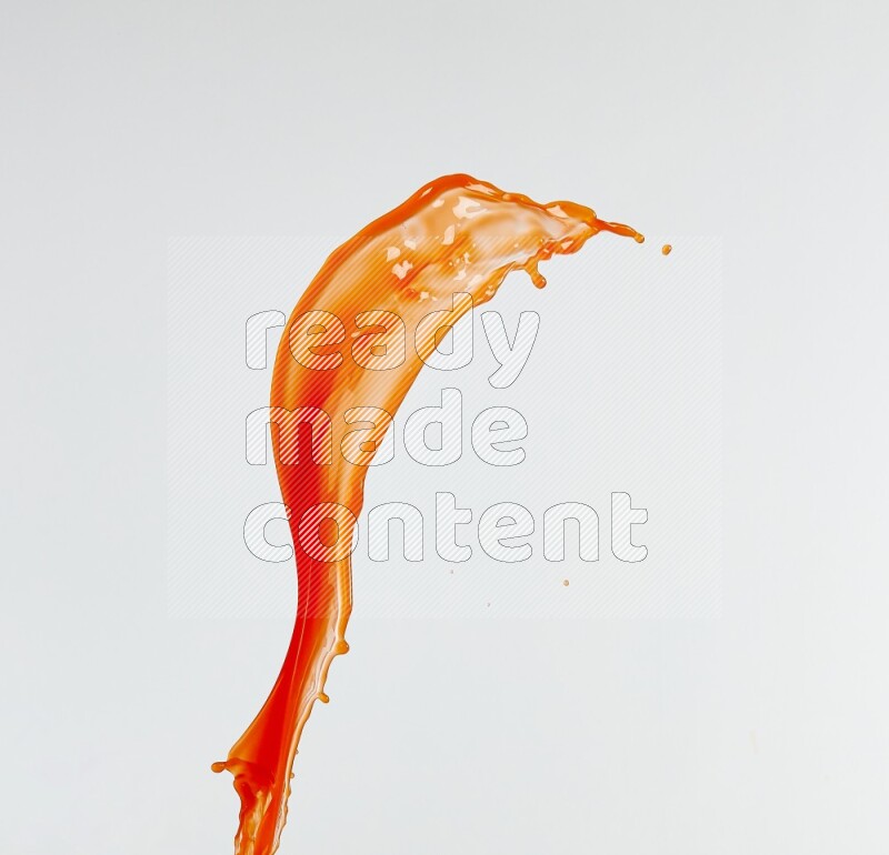 Orange liquid splash and drops on white background