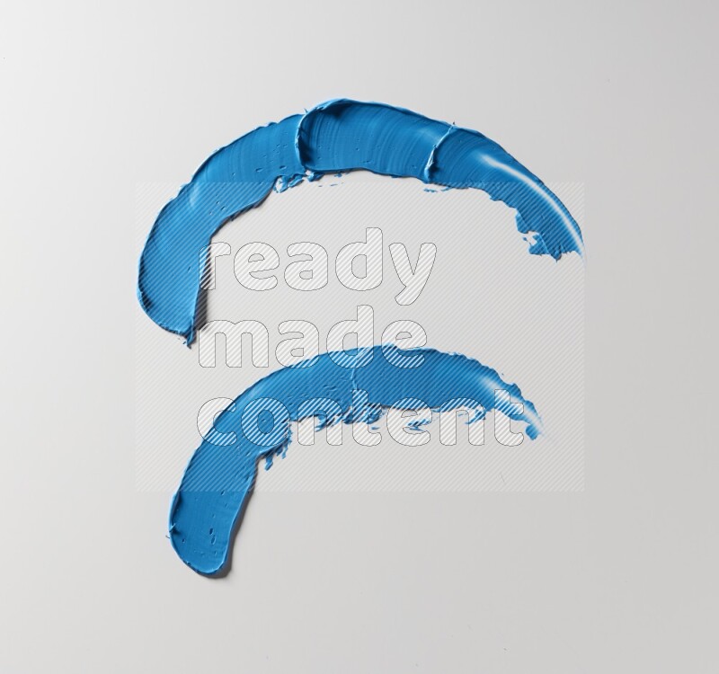 Blue curved painting knife strokes on white background