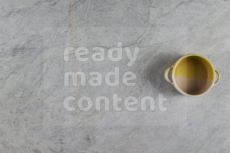 A multicolored pottery Bowl on grey marble background