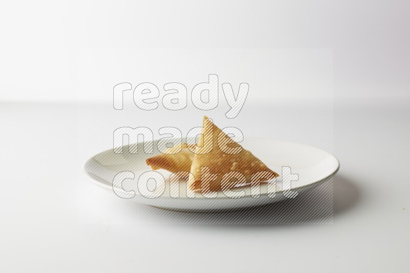 sambosas on a white background