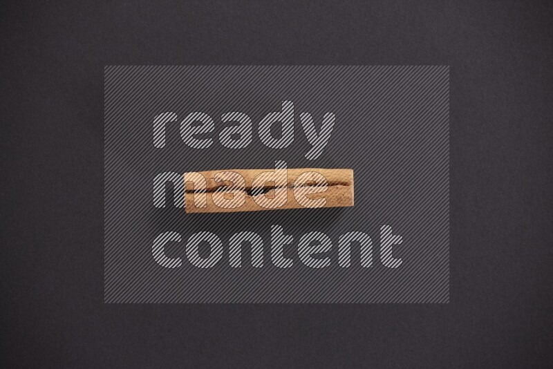 Cinnamon stick on black background