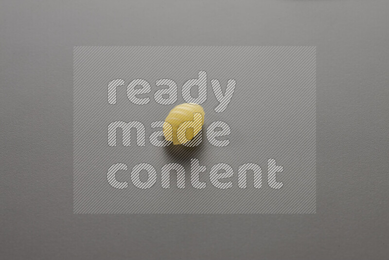 Shells pasta on grey background