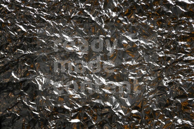 Aluminium foil on black background