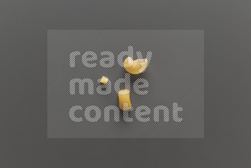 Different pasta types on grey background