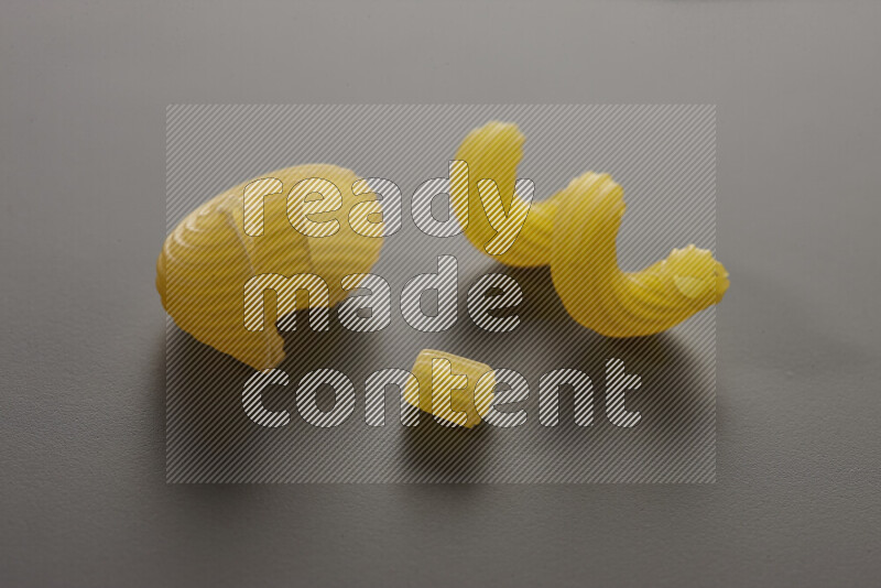 Different pasta types on grey background