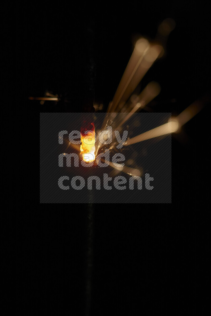 A close-up image of sparkler candle isolated on black background