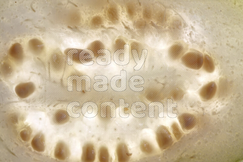 Guava slices on illuminated white background