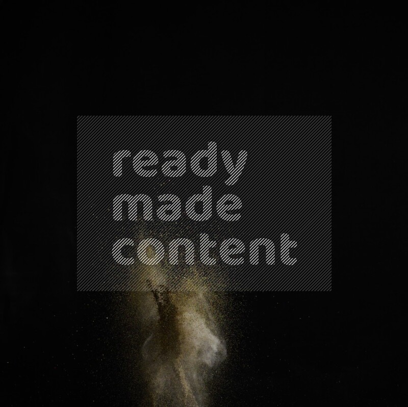 A side view of brown powder explosion on black background