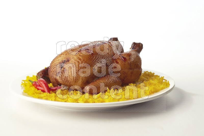 yellow  basmati Rice with  whole roasted chicken on a white rounded plate direct on white background