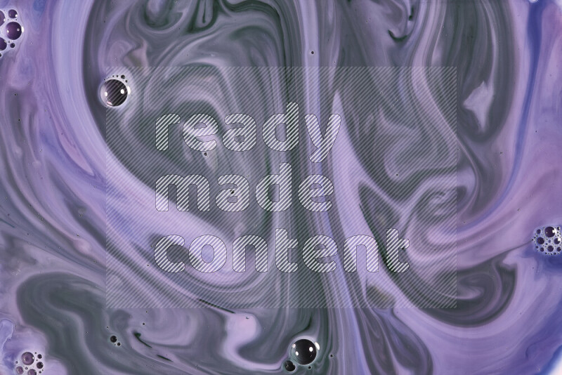 A close-up of abstract swirling patterns in blue, pink and green