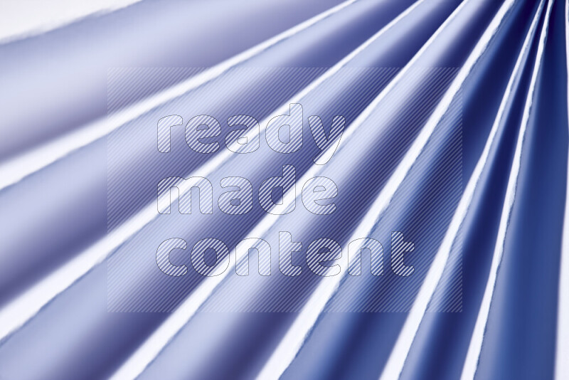An image presenting an abstract paper pattern of lines in blue and white tones