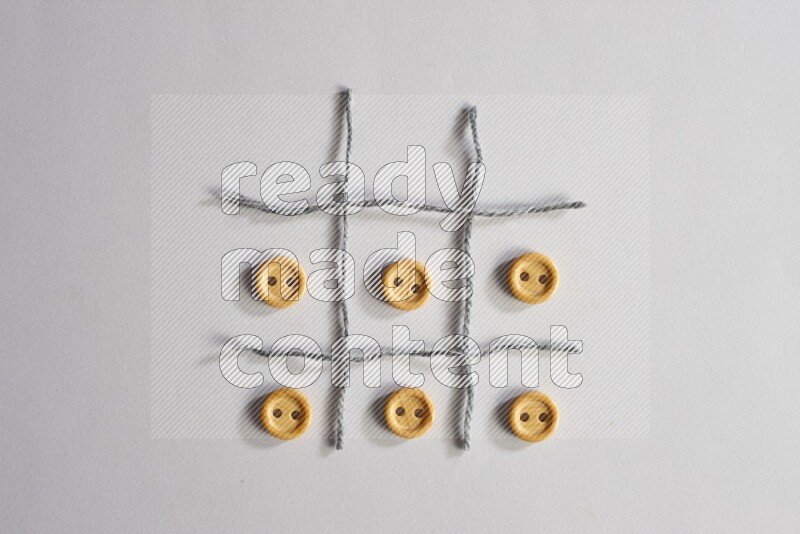 Wooden buttons placed on grey background