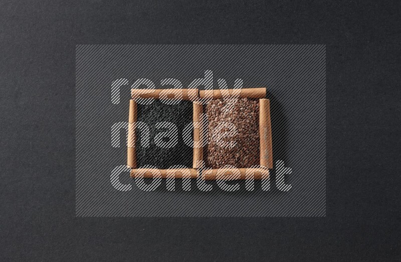 2 squares of cinnamon sticks full of flaxseeds and black seeds on black flooring
