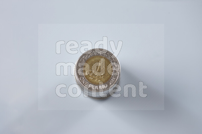 Stack Egyptian one pound coins on grey background