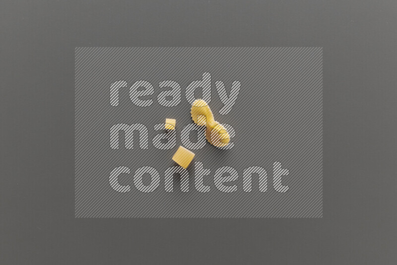 Different pasta types on grey background