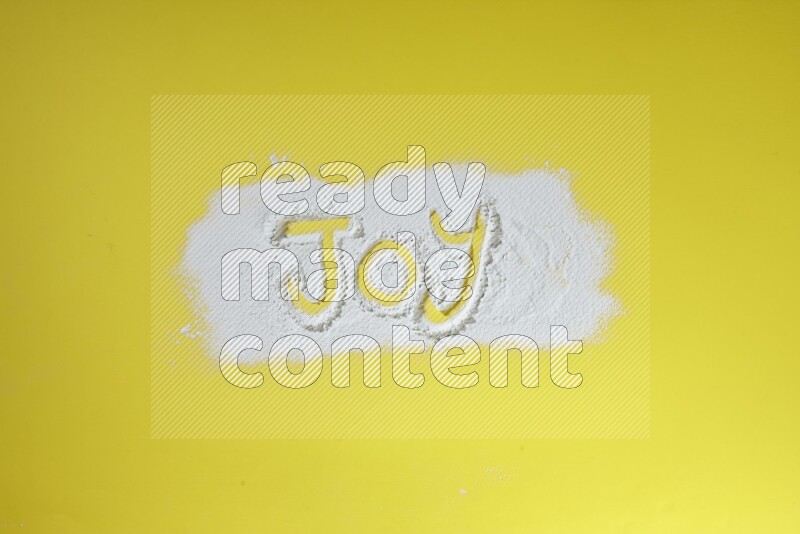 A word written with powder on yellow background