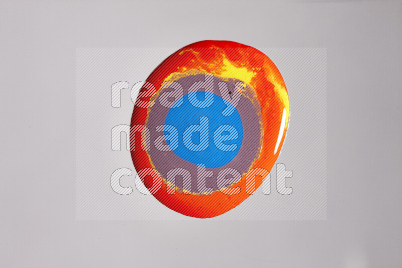 Close-ups of assorted colors blending on a grey background