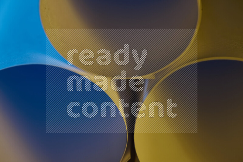 The image shows an abstract paper art with circular shapes in varying shades of blue and warm tones