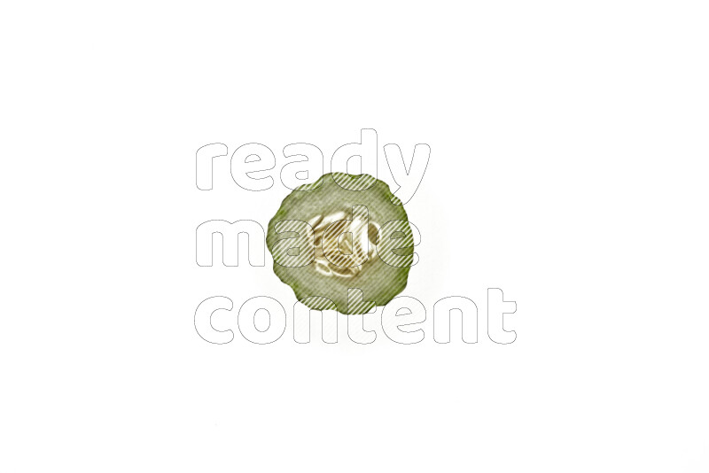 Cucumber slices on illuminated white background