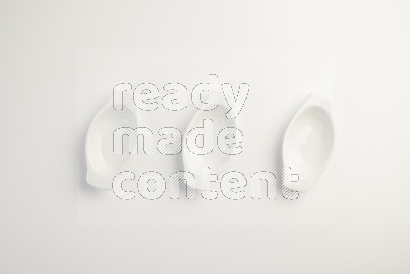 white ceramic oval sauce dish on white countertop