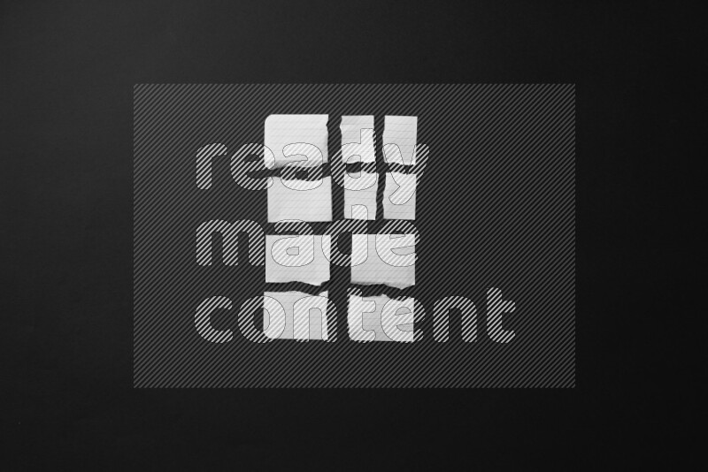 Ripped notebook sheet on black background