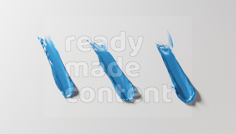 Blue painting knife strokes on white background