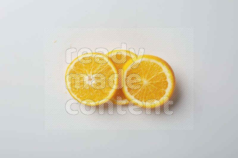 Three orange slices on a white background