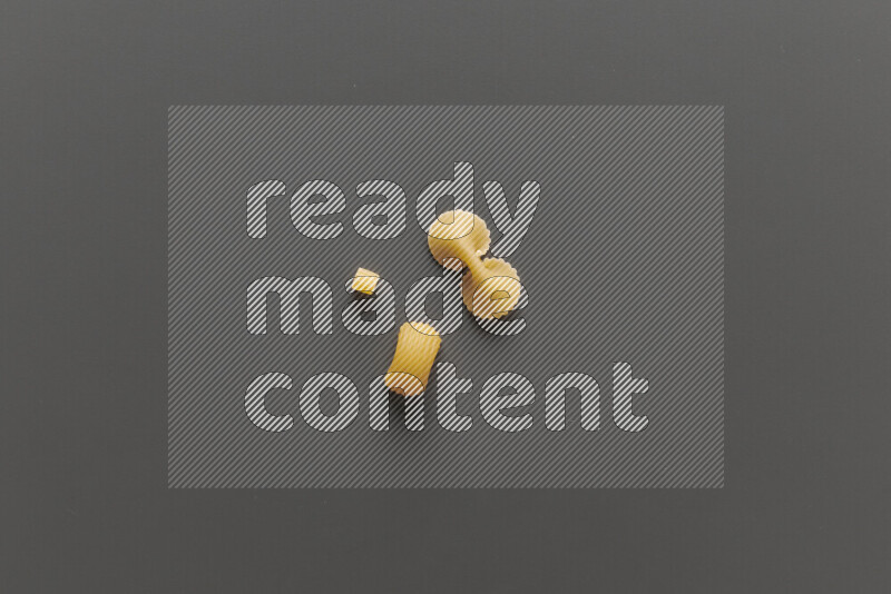Different pasta types on grey background