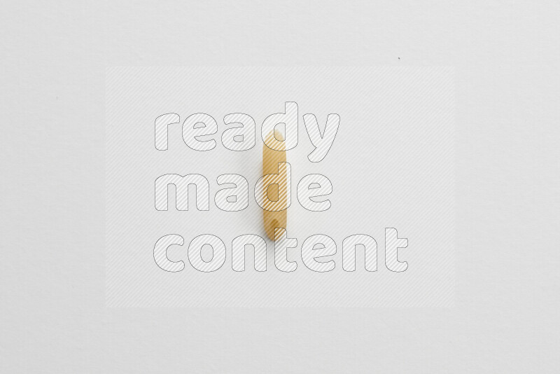 Mini penne pasta on white background