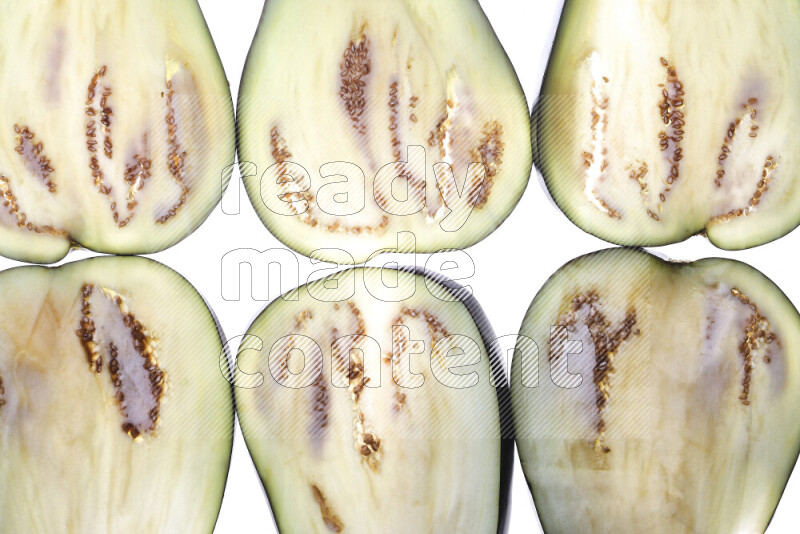 Eggplant slices on illuminated white background