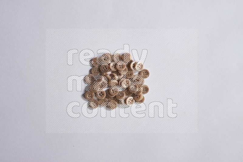 Brown buttons placed on grey background