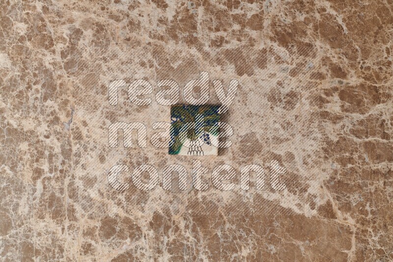 A decorative coaster on beige marble background
