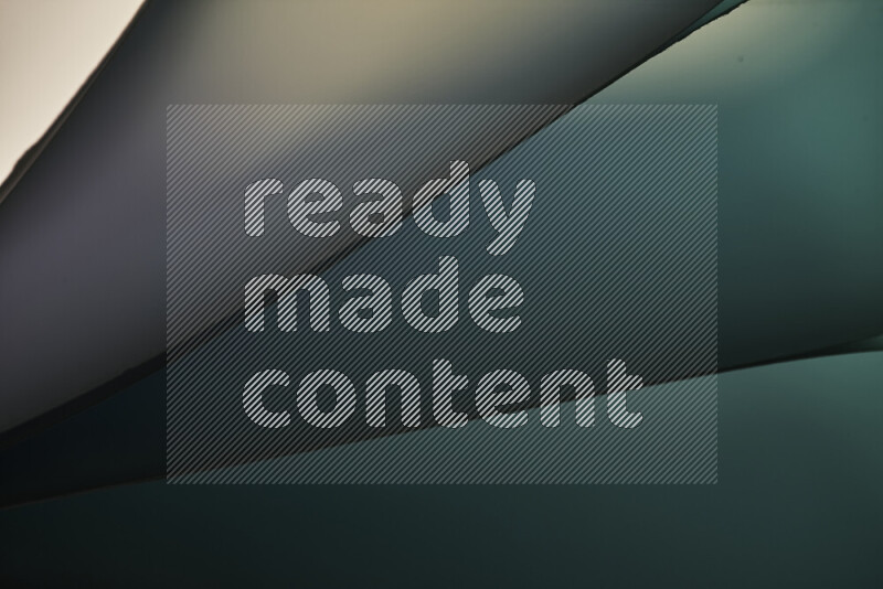 An abstract art piece displaying smooth curves in cold gradients created by colored light