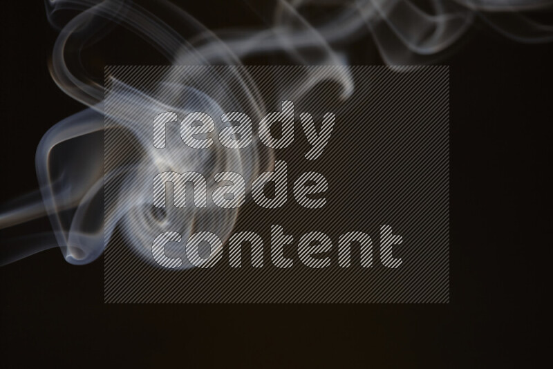 Motion of wavy smoke isolated on dark background