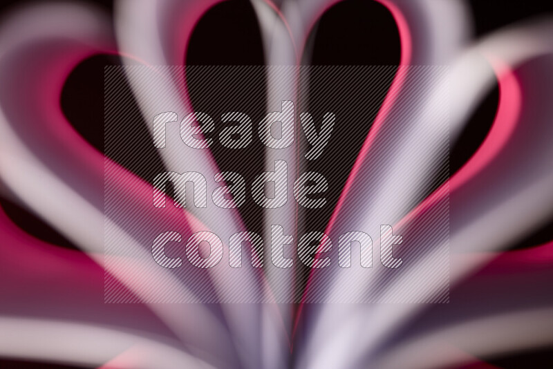 An abstract art piece displaying smooth curves in pink gradients created by colored light