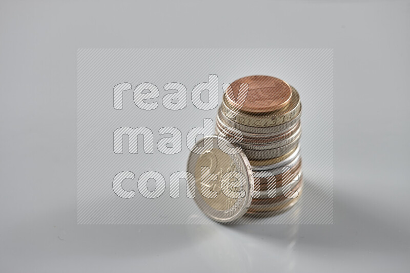 Random old coins on grey background