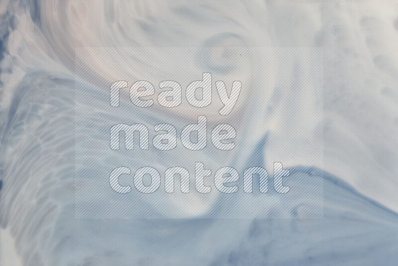 A close-up of abstract swirling patterns in blue and white